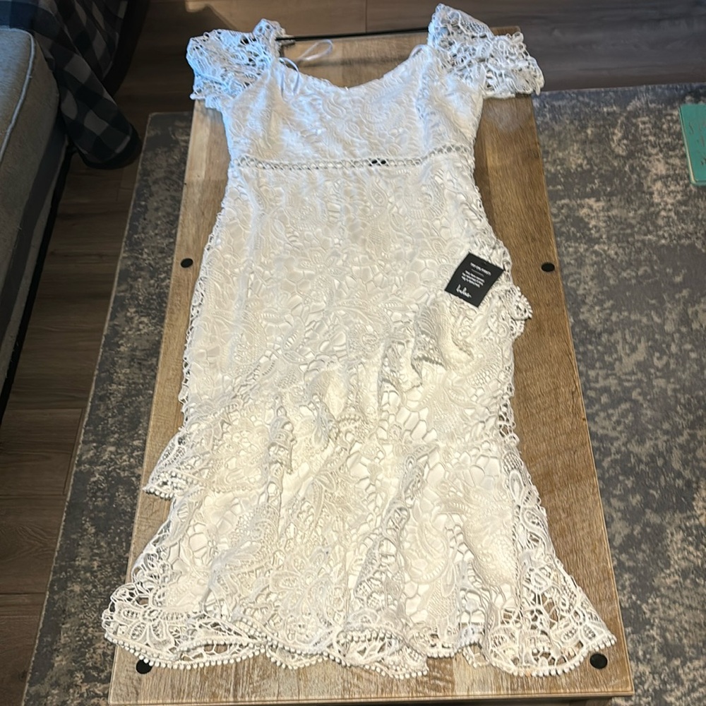 Lulus dress with cut out in the middle and zipper back. Never worn.